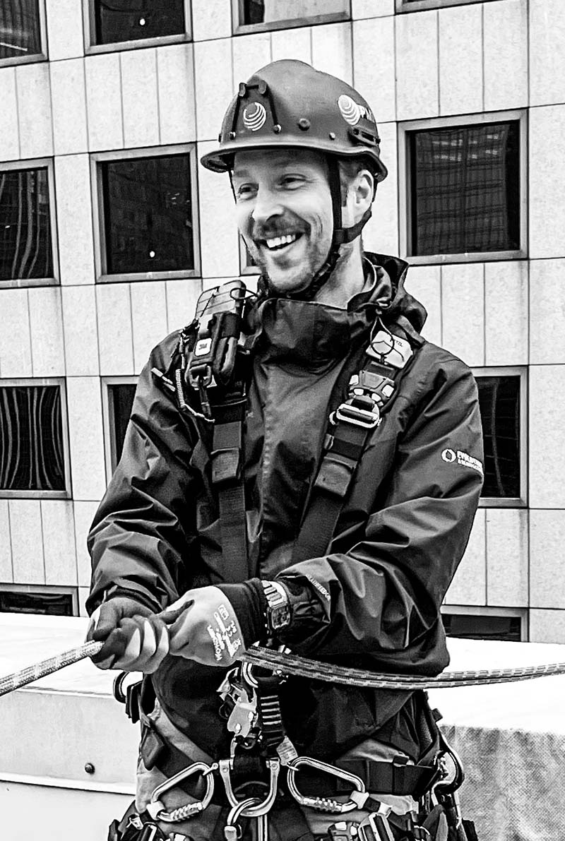 Man in repelling gear